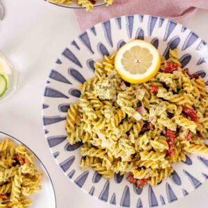fusilli pasta with pesto, olives, red onion and sundried tomatoes