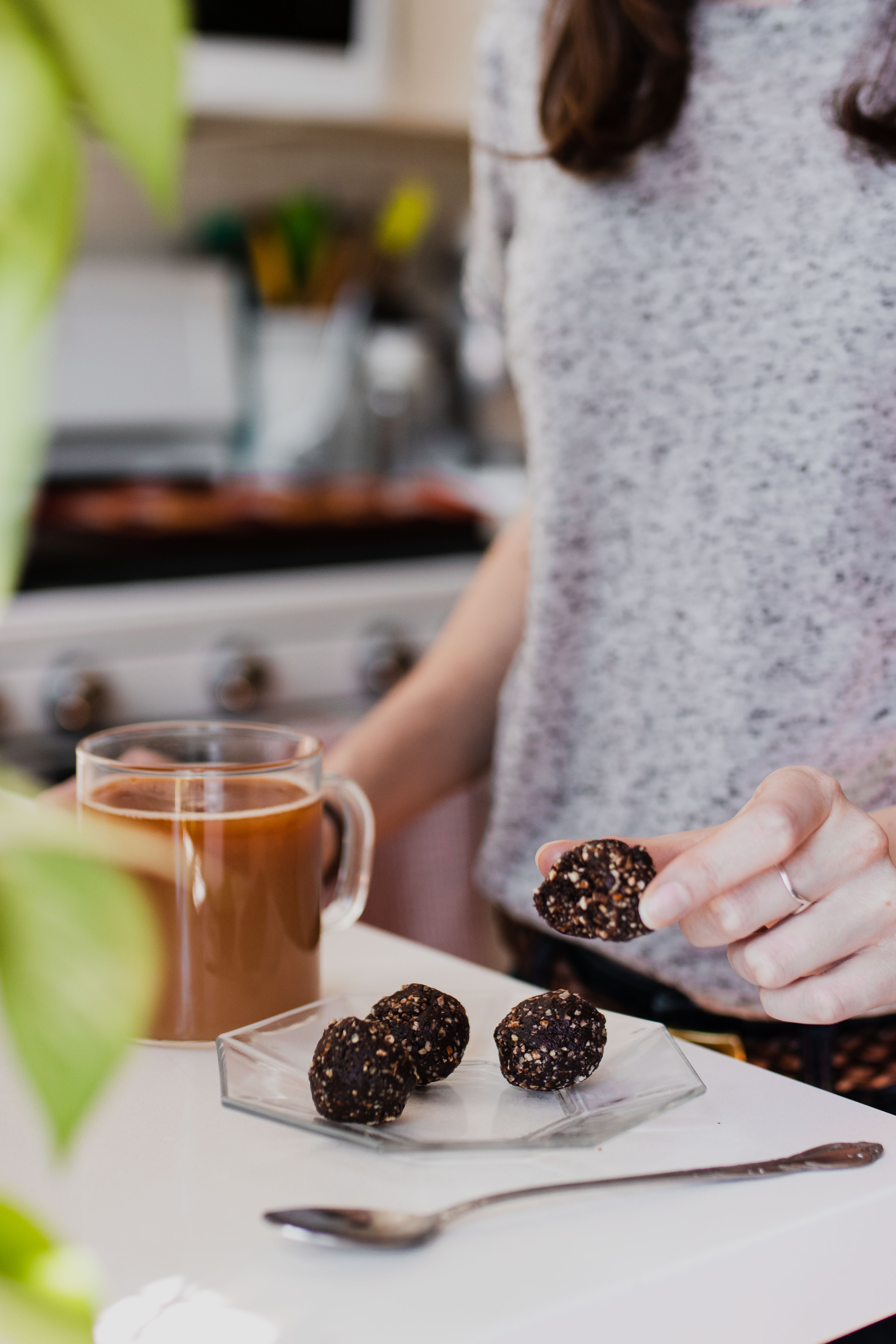 raw brownie bites on kitchen counter with tea
