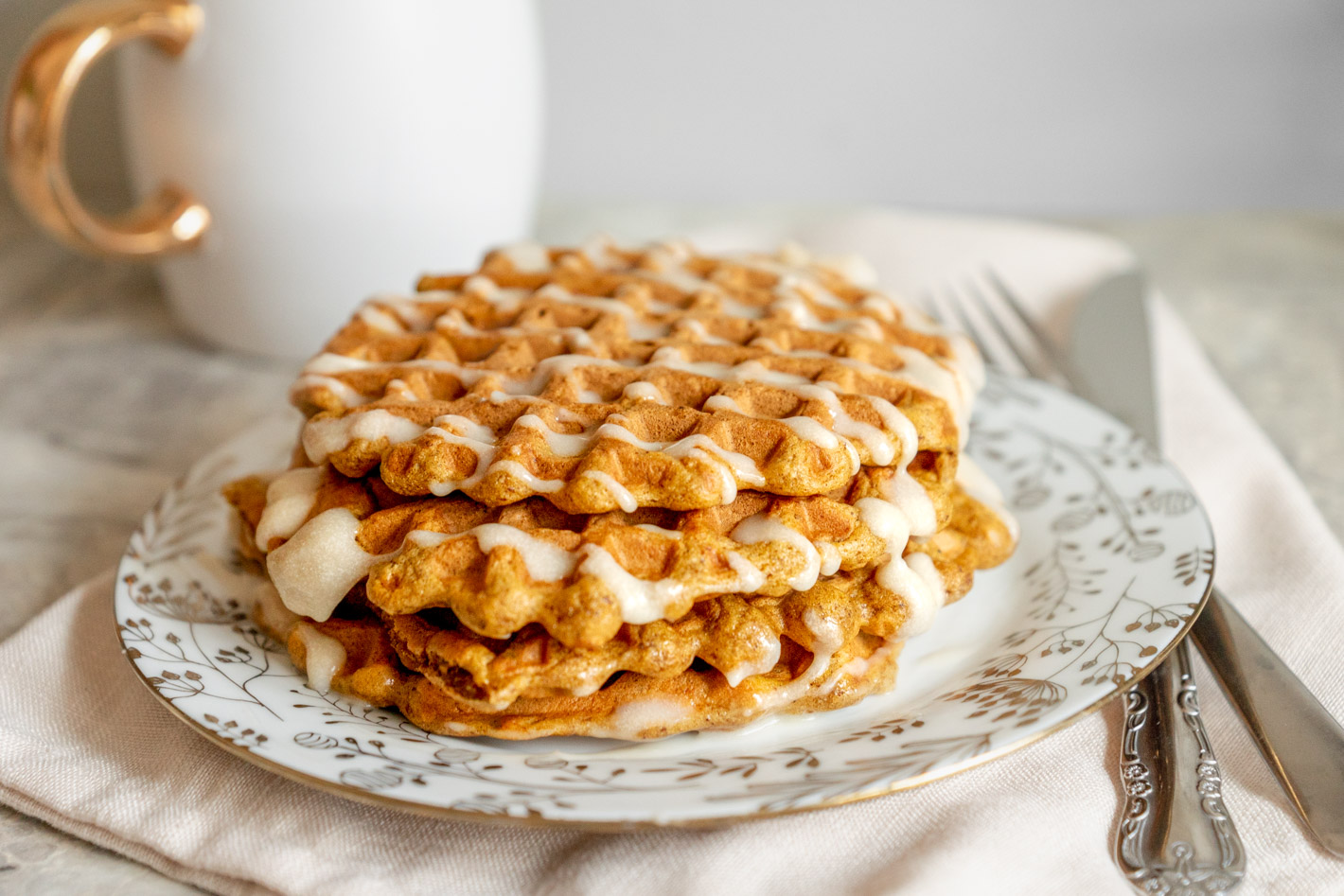 pumpkin spice waffles with maple cream cheese icing